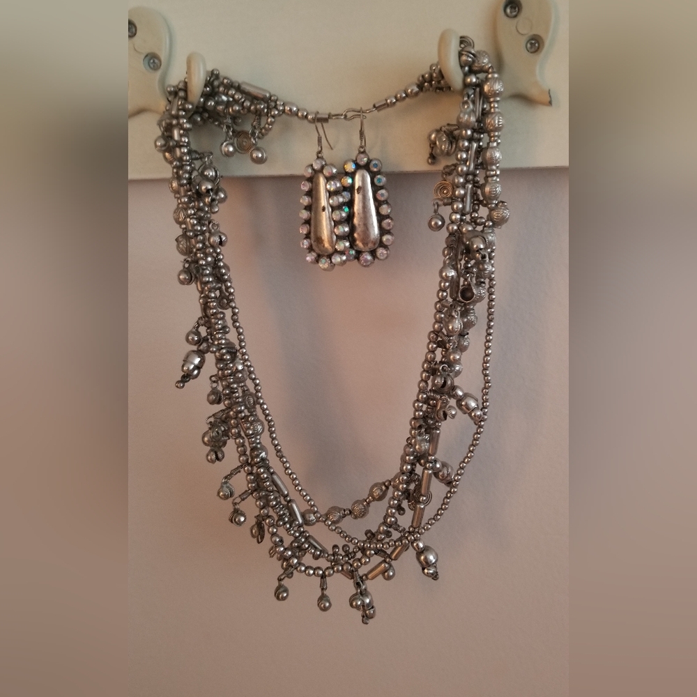Eclectic, eye catching necklace with cute earrings to match for free
